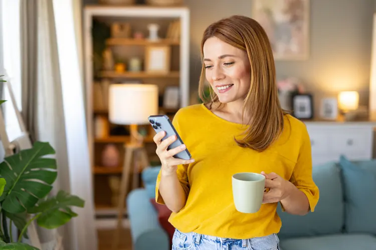 lady in living room happy with tax results